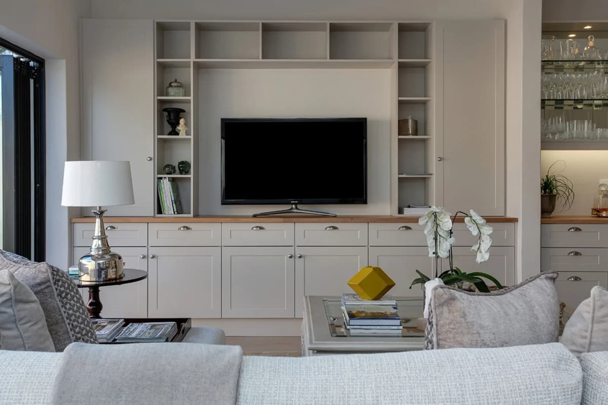 White Built-In TV Wall Unit with Cabinetry
